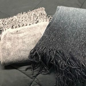 2 woman’s gray scarfs